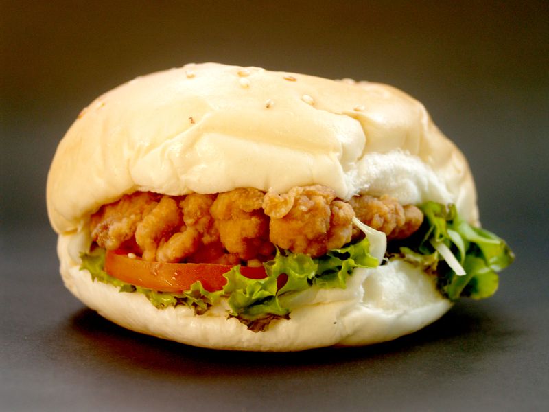 Classic roast chicken burger with fresh lettuce and golden bun